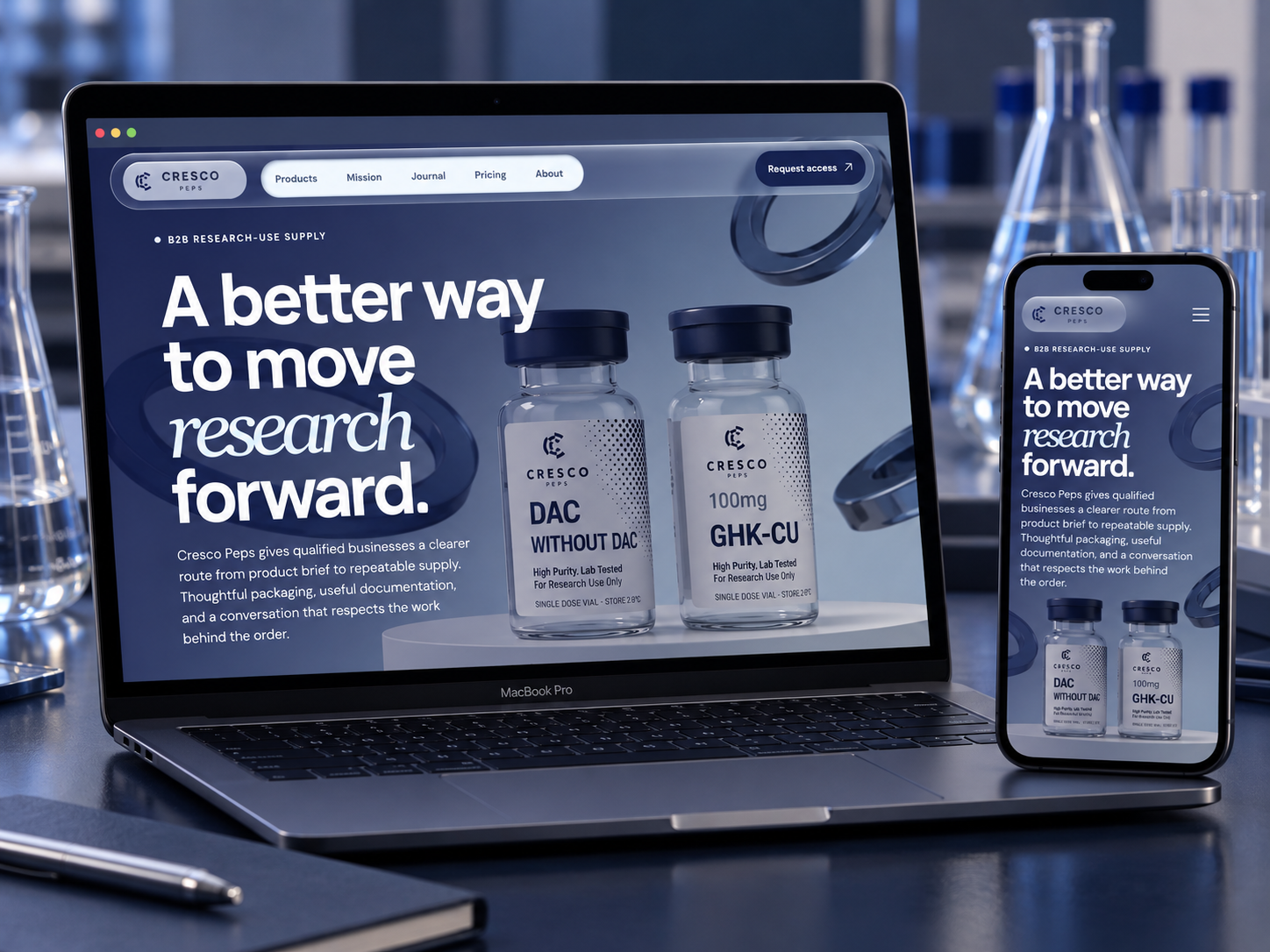 Cresco Peps design shown on a MacBook Pro and phone in a navy laboratory setting
